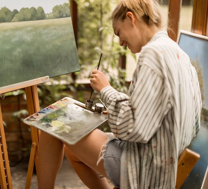 back of woman who is painting